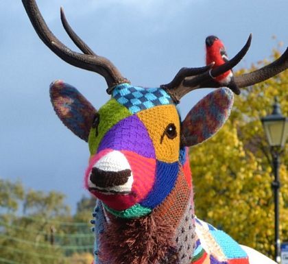 knitted-bird-sitting-on deer