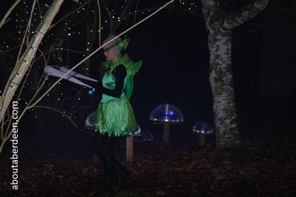 fairy juggling in dark forest