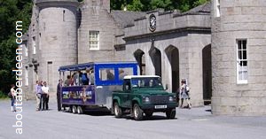 train cariage pulled by a land rover